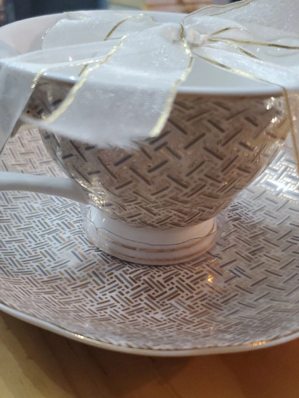 White and Gold Porcelain Teacup & Saucer - Decorative Pattern